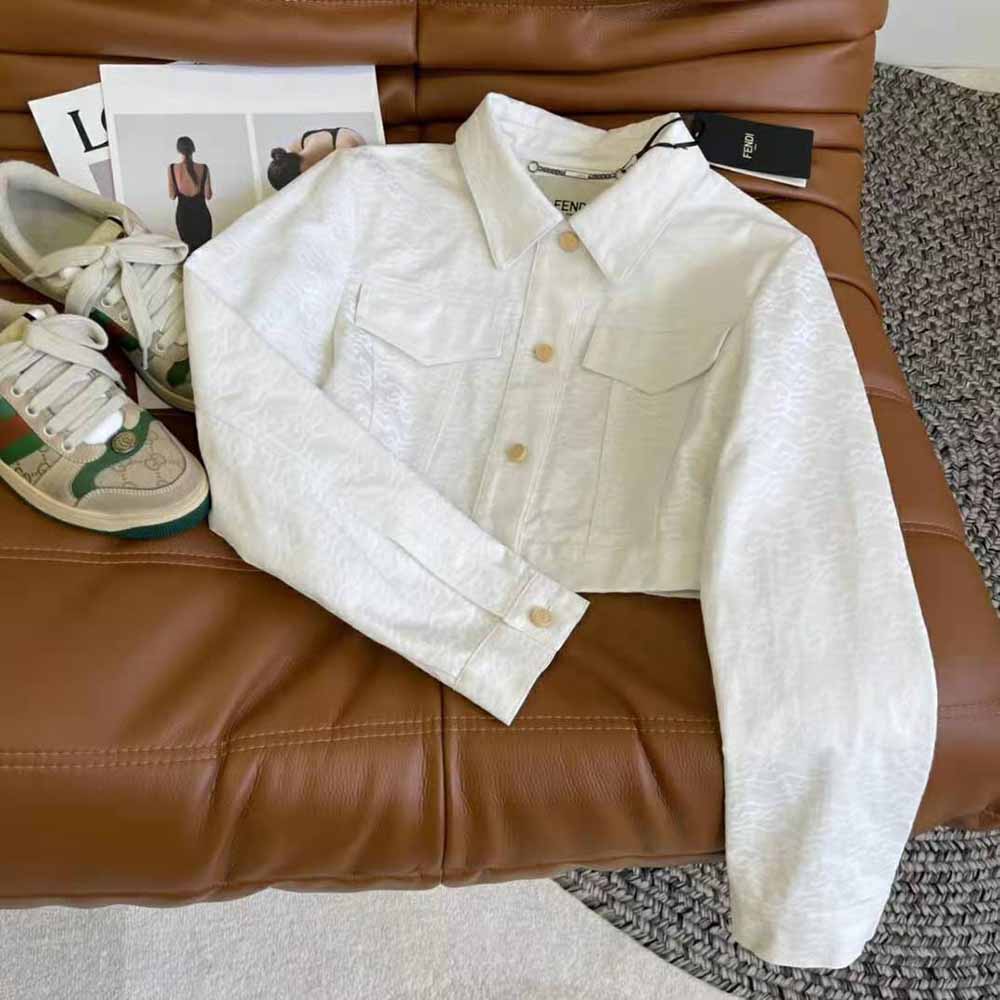 Close-up of Fendi logo buttons on White Denim Cropped Jacket