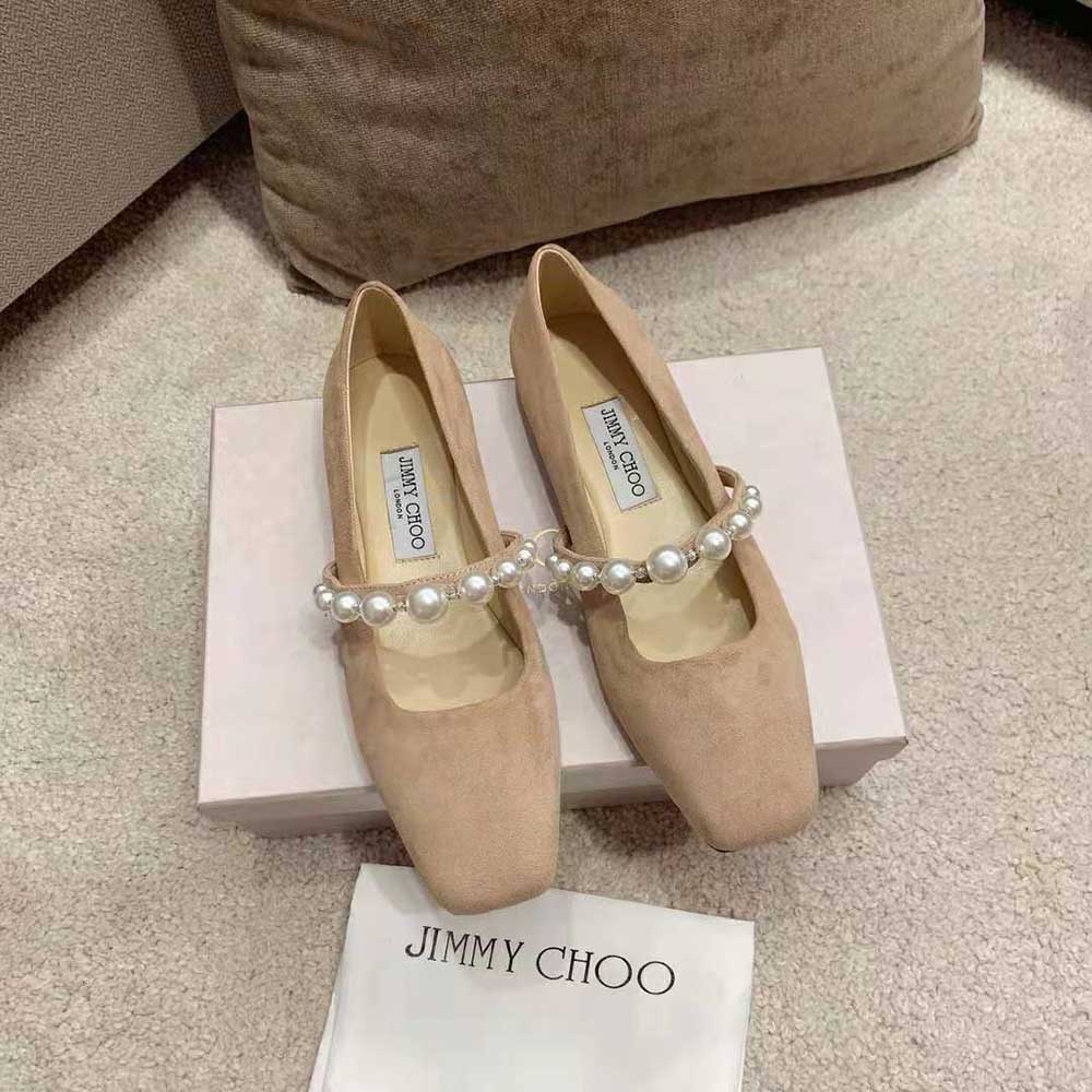 Close-up of pearl embellishment on Jimmy Choo ADE Pink Suede Flats