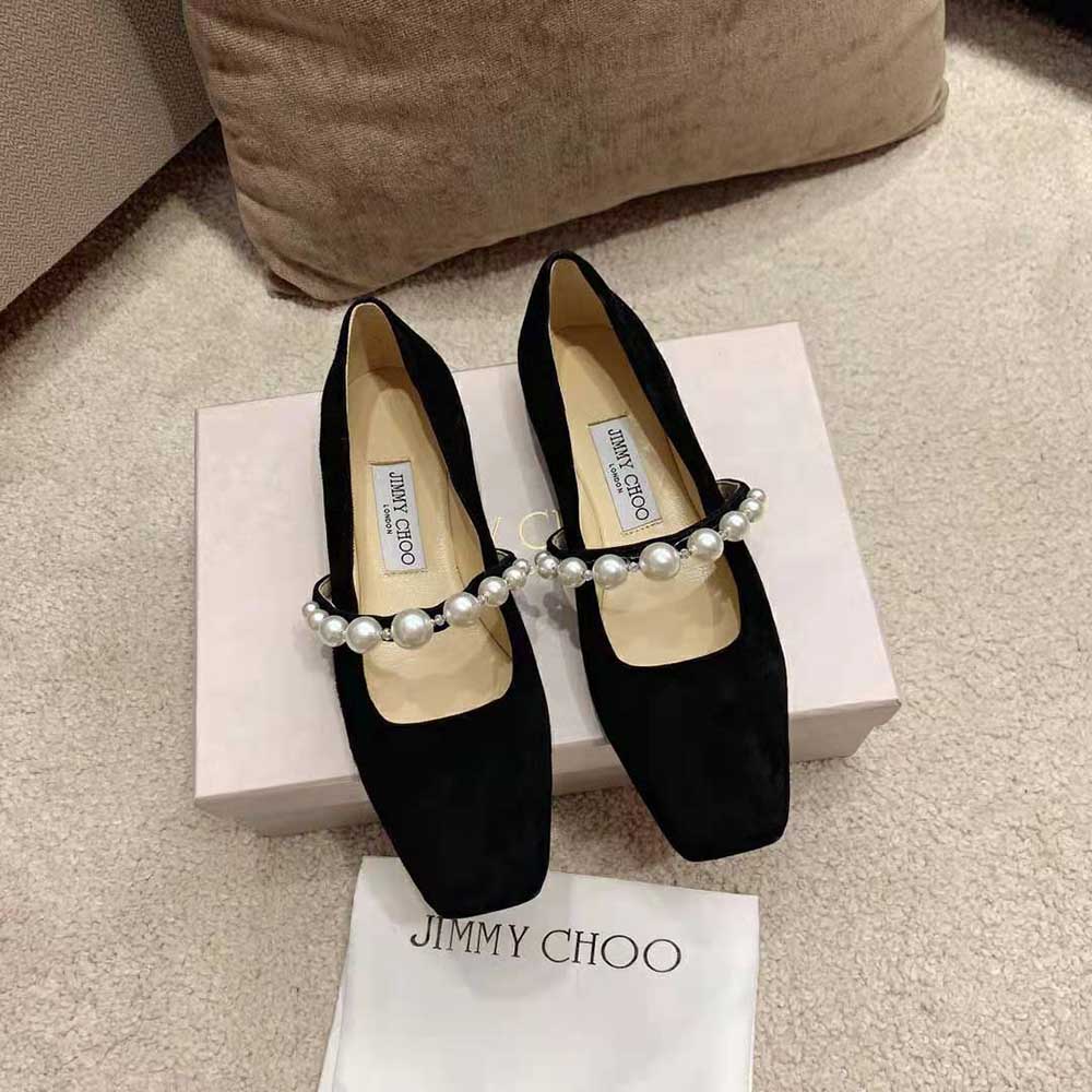 Close-up of pearl embellishment on Jimmy Choo Women ADE Black Suede Flats