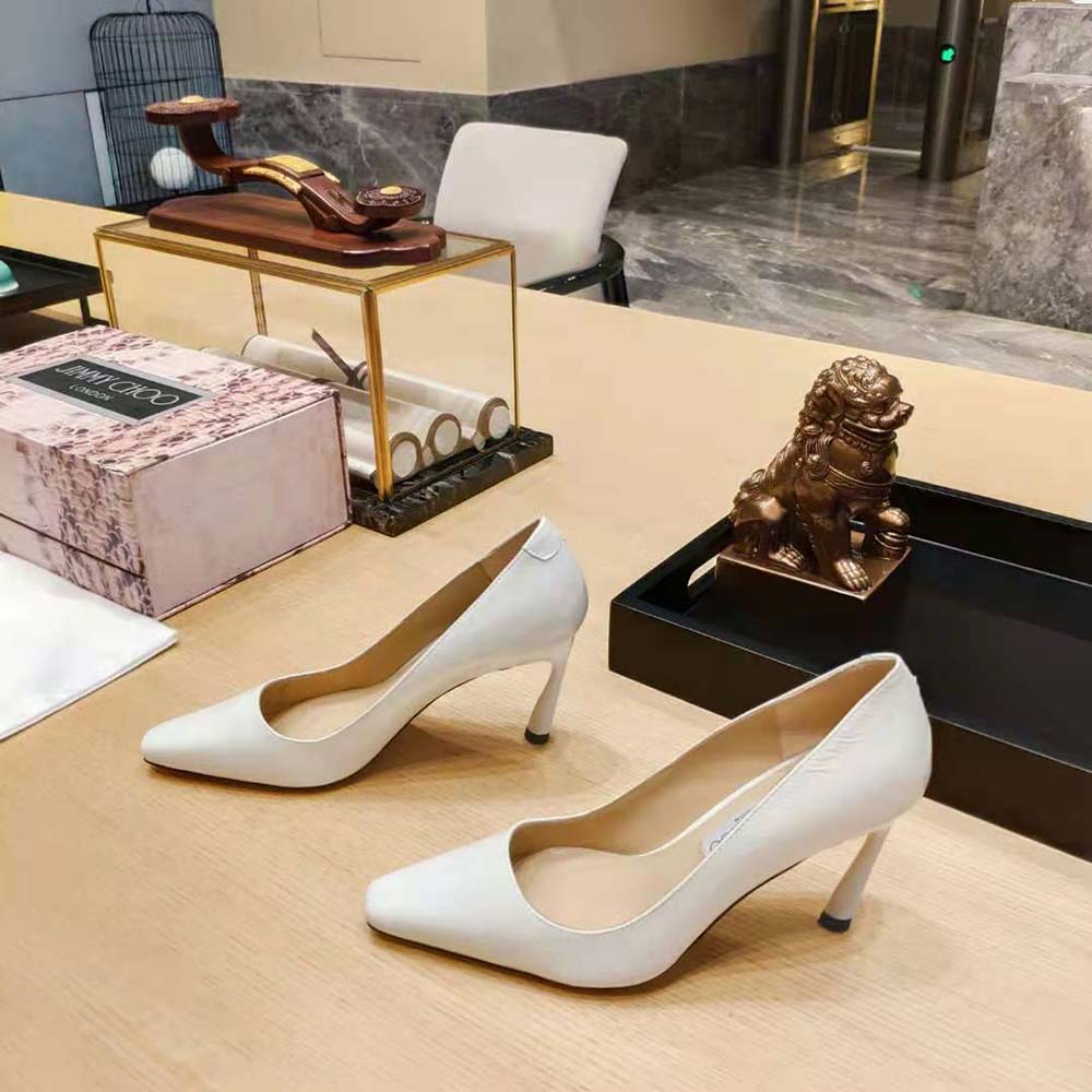 Side view showcasing glossy finish of Jimmy Choo Brittany 100 White Naplack Pumps