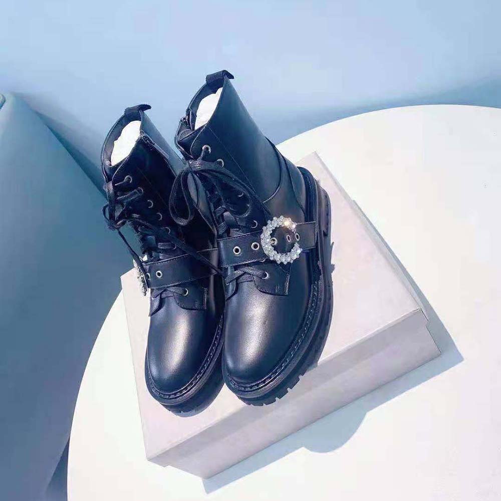 Close-up of crystal buckle detail on Jimmy Choo Cora Flat Combat Boots