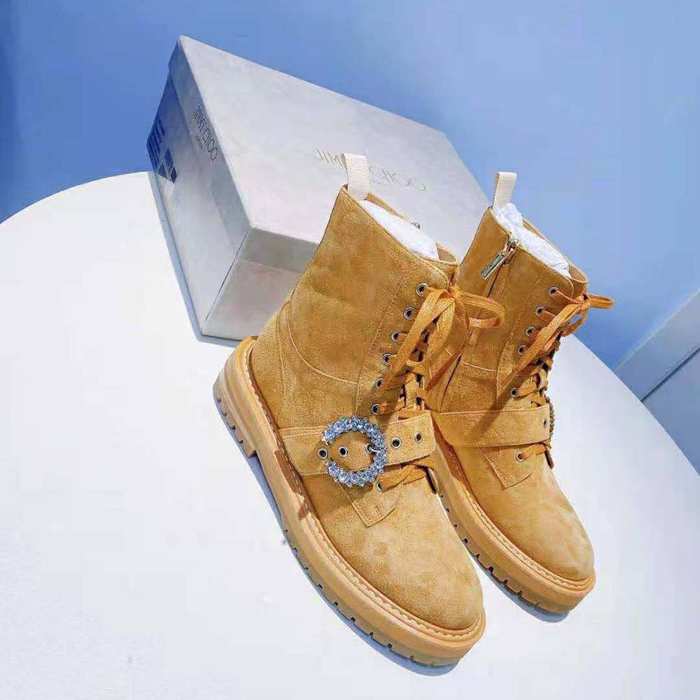 Close-up on the crystal buckle detail of Jimmy Choo Cora combat boots