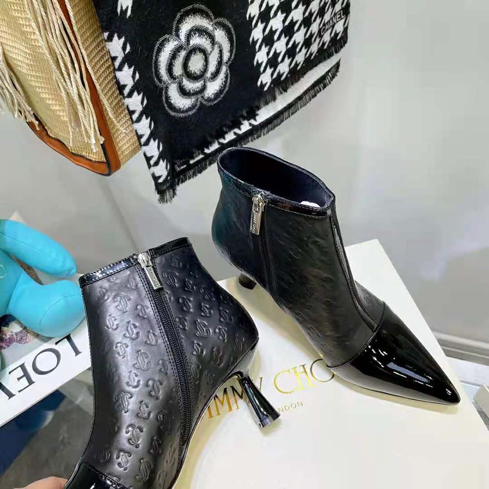Side view highlighting 65mm stiletto heel of Jimmy Choo ankle boots