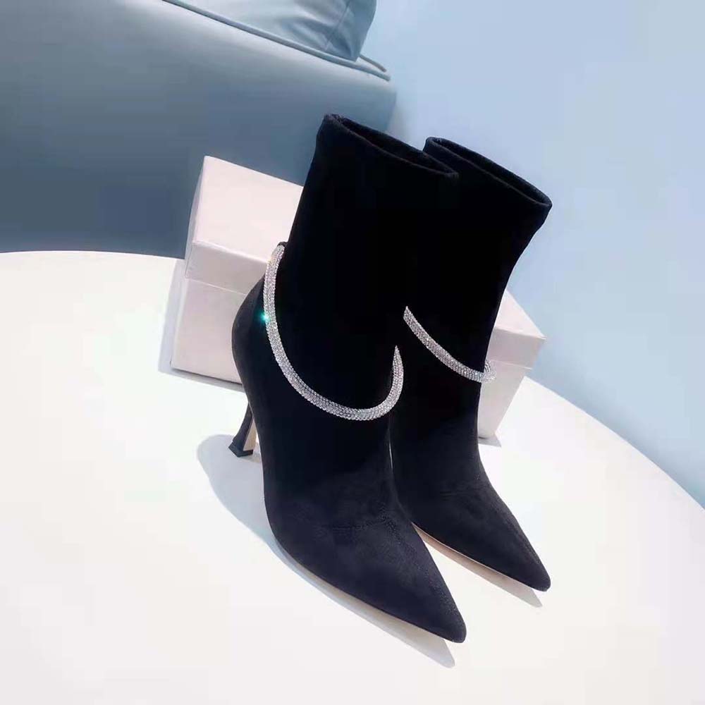 Close-up of crystal embellishment on ankle cuff of Jimmy Choo Leroy 90 boots