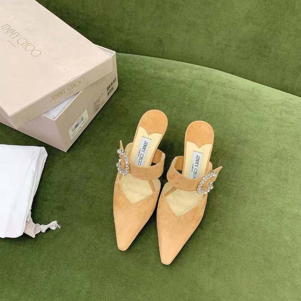 Close-up of sparkling crystal buckle on Jimmy Choo Marta 70 Caramel Suede Mules