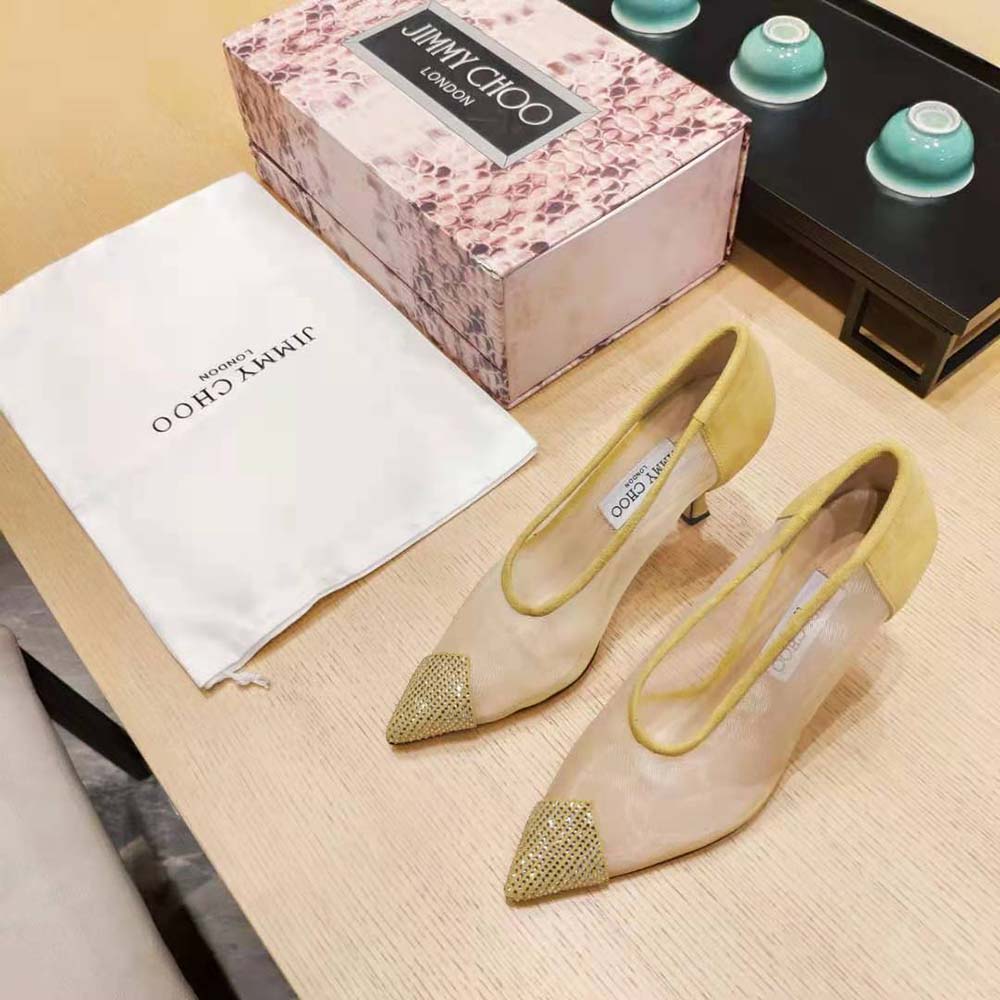 Close-up of crystal embellishment on Jimmy Choo Nicole 90 yellow pumps