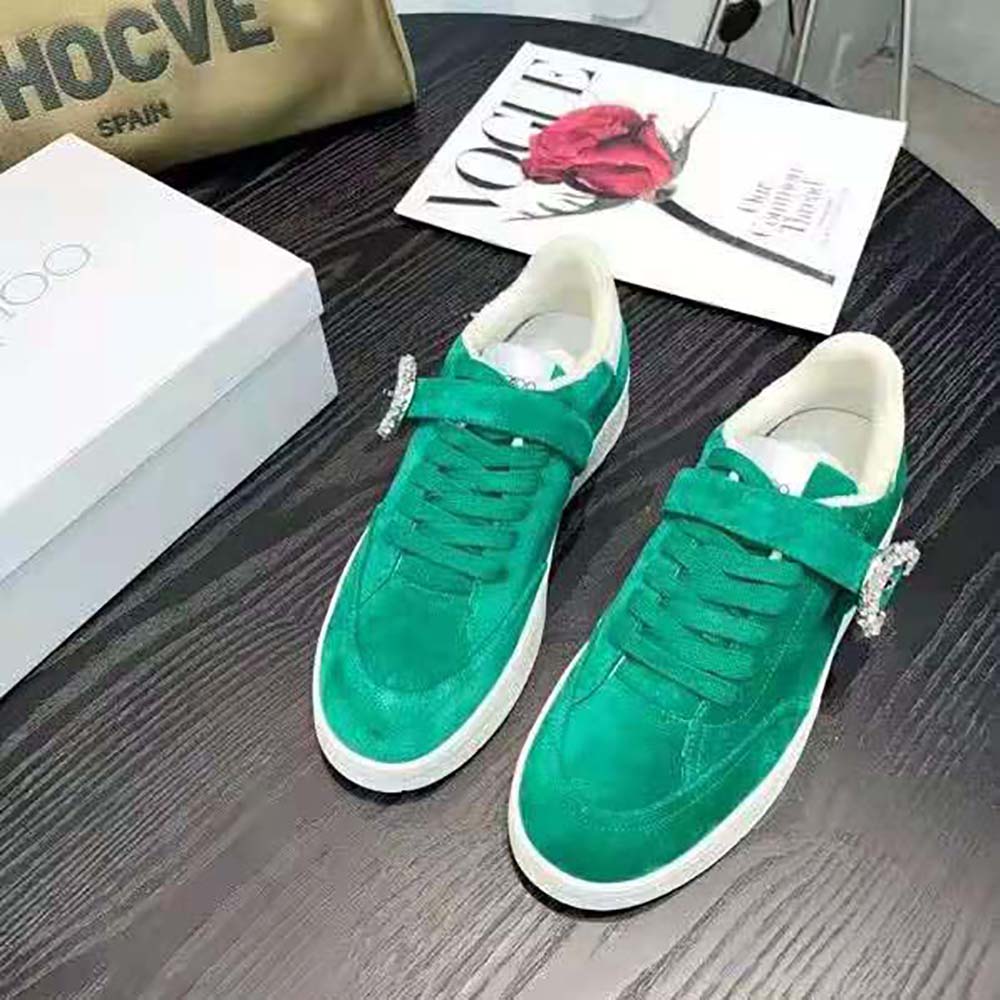 Close-up of green suede and white calf leather on Jimmy Choo Osaka low top trainers