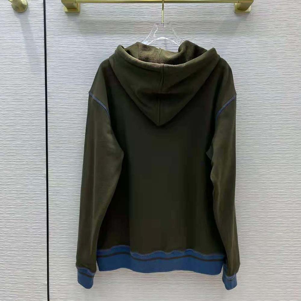 Side angle showing drawstring and ribbed hem on Loewe hoodie