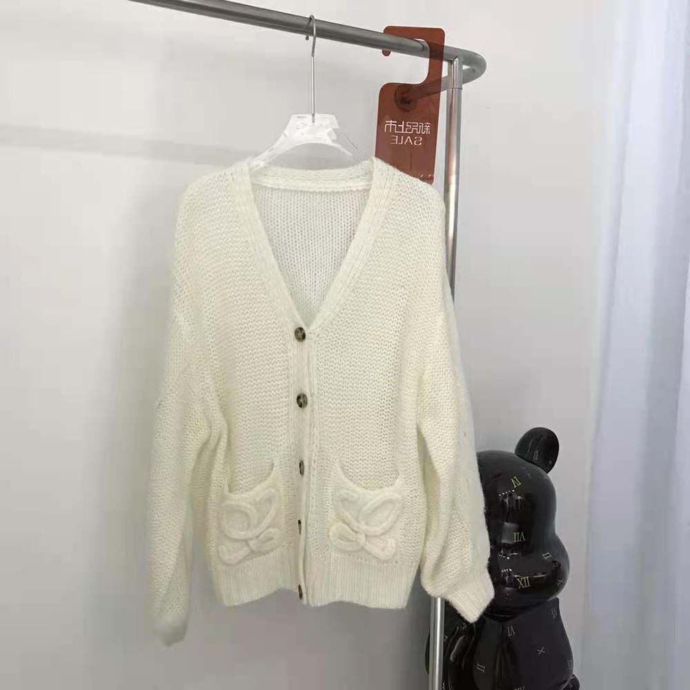 Close-up of white mohair knit and Anagram embroidery on Loewe cardigan