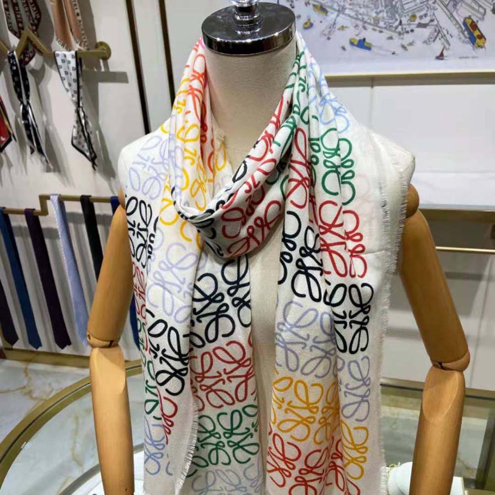 Close-up of white Loewe scarf showcasing signature Anagram lines