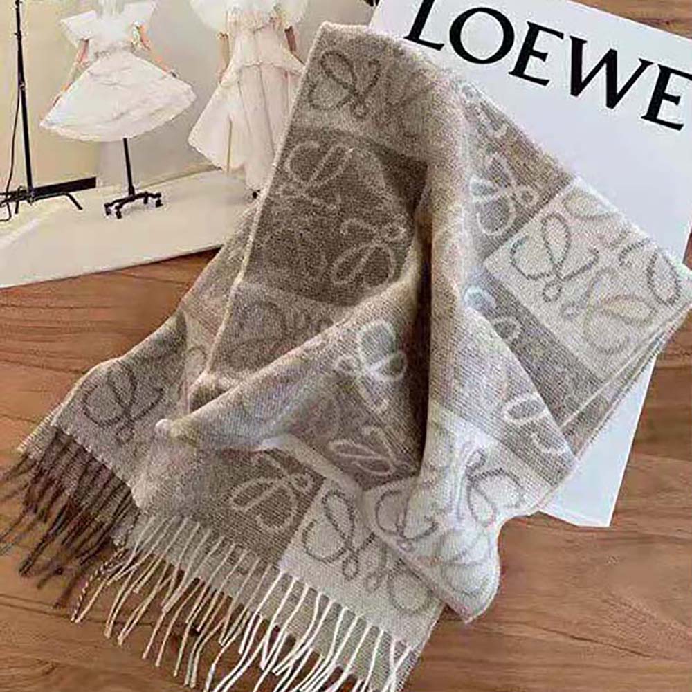 Close-up detail of embossed Anagram on Loewe Women Anagram Scarf beige wool-cashmere fabric