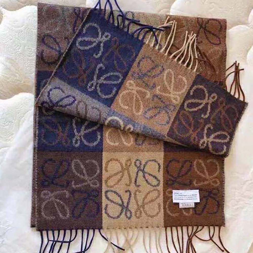 Close-up detail of the Loewe Anagram embroidery on navy scarf