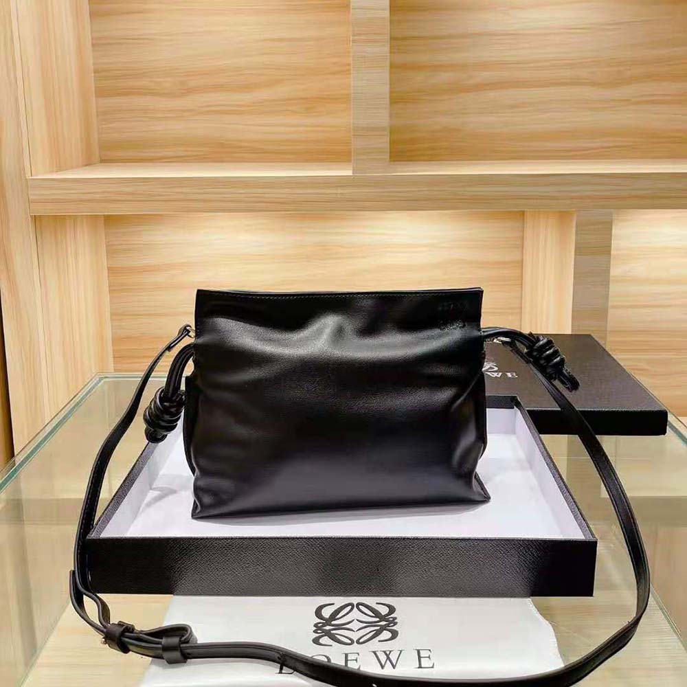 Side angle showing slim silhouette of Loewe Women Flamenco Clutch