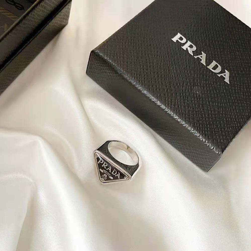 Side angle showing slim band of Prada Women 925 Sterling Silver with Enamel Symbole Ring