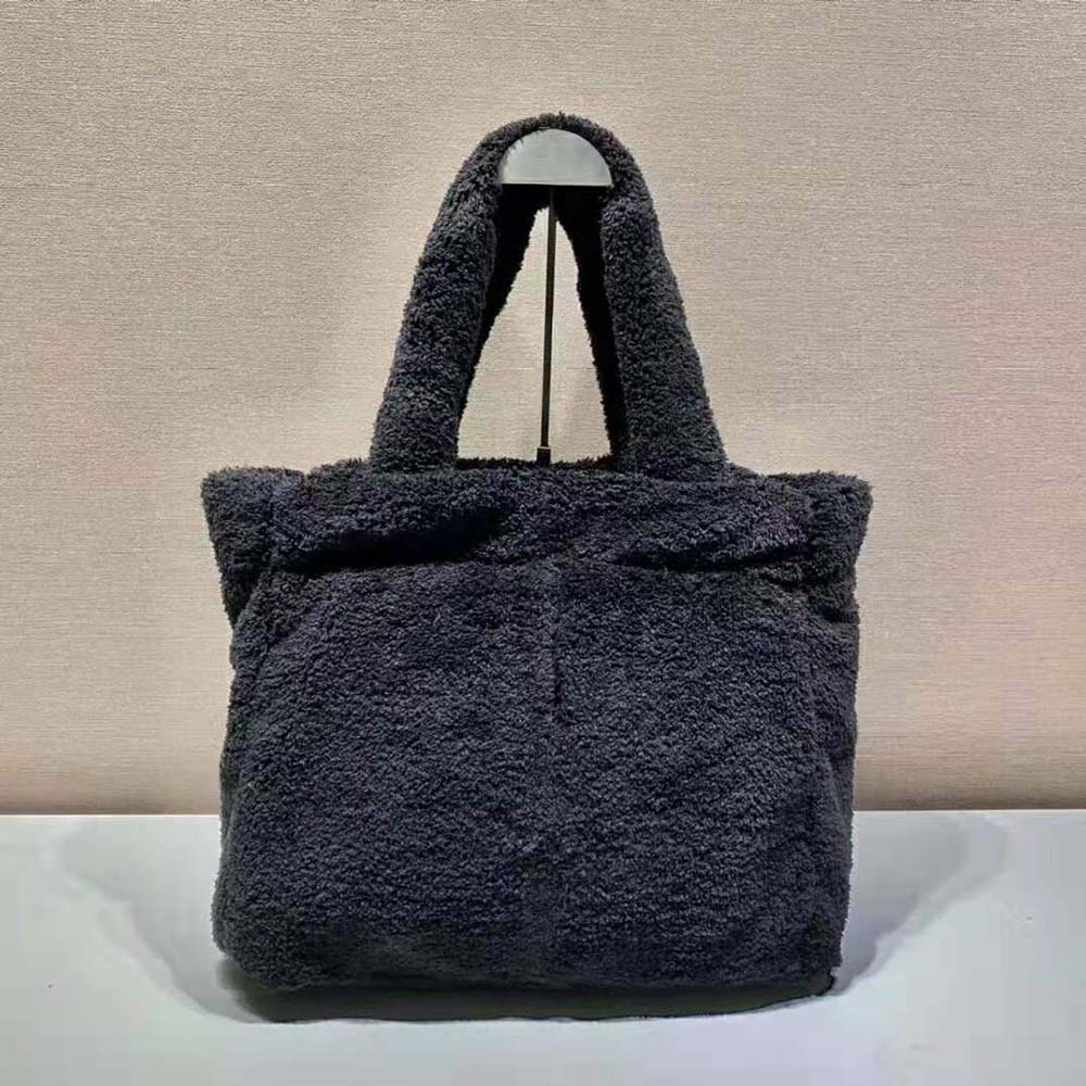 Side angle showing zipper closure and terry fabric texture on Prada tote
