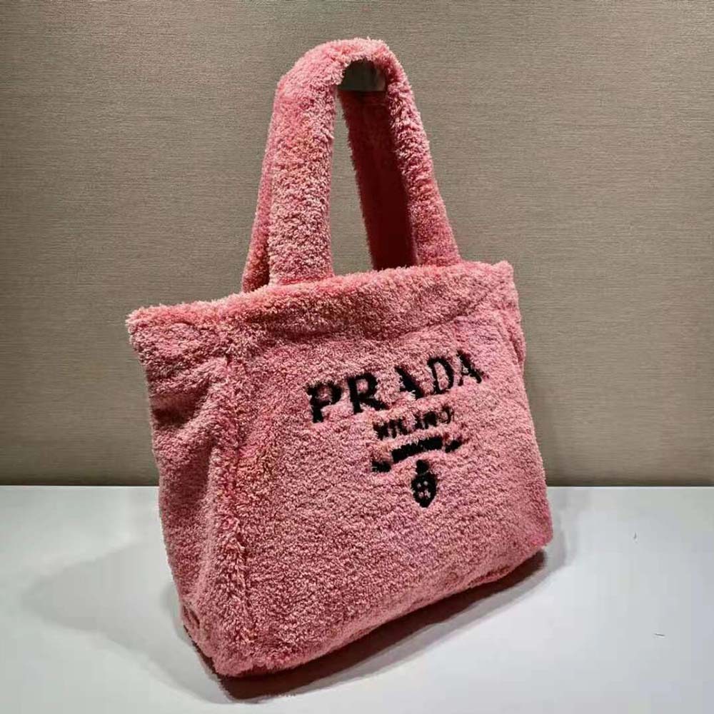 Side view showing spacious silhouette of Prada Women Enameled Metal Triangle Logo Terry Tote Bag-Pink