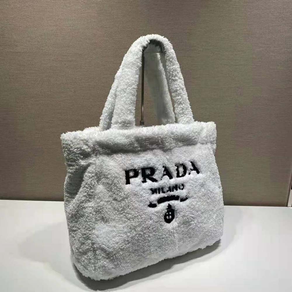 Side angle showing zip closure and terrycloth texture of Prada White Tote Bag