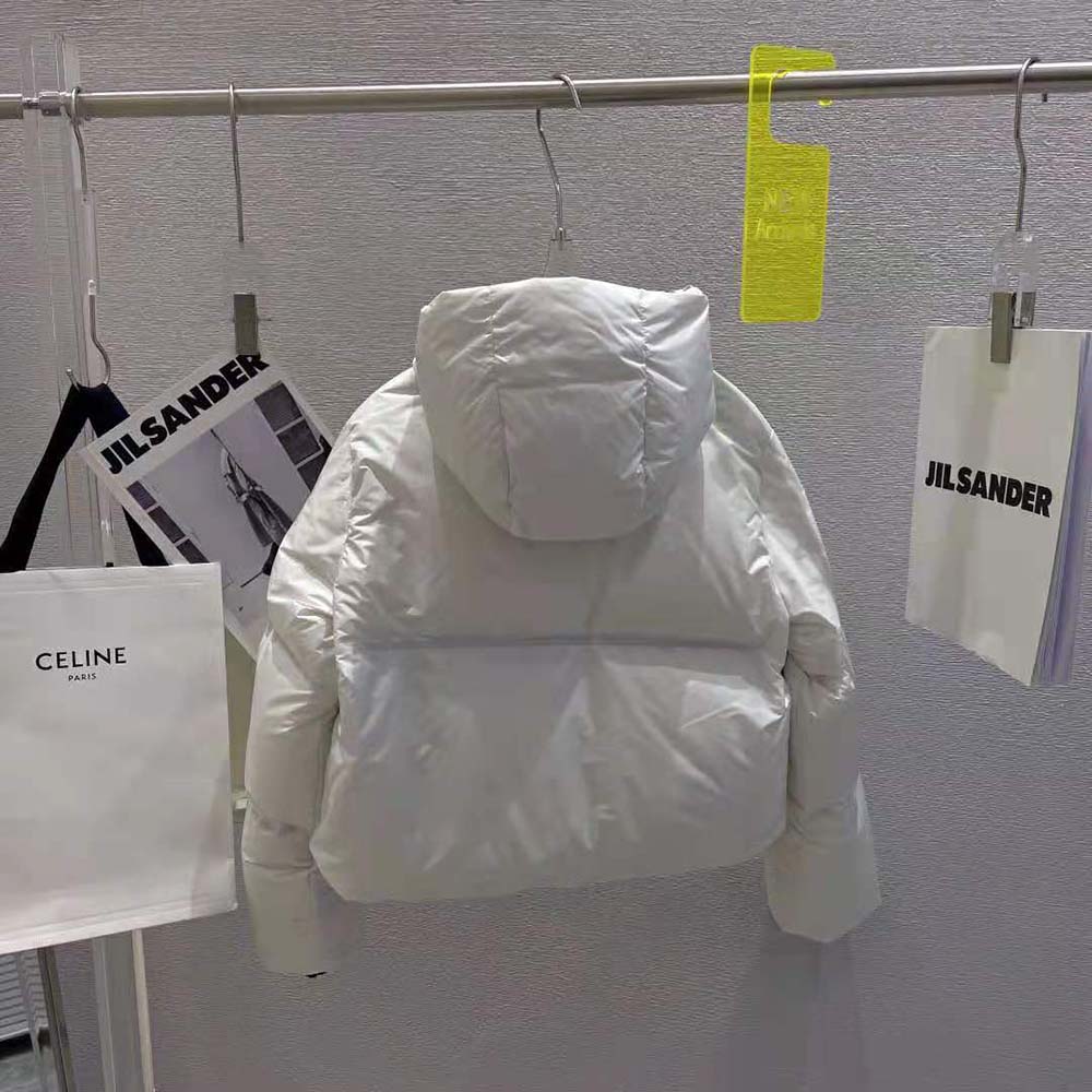 Side angle showing slim fit of Prada Women Light Polyester Puffer Jacket-White