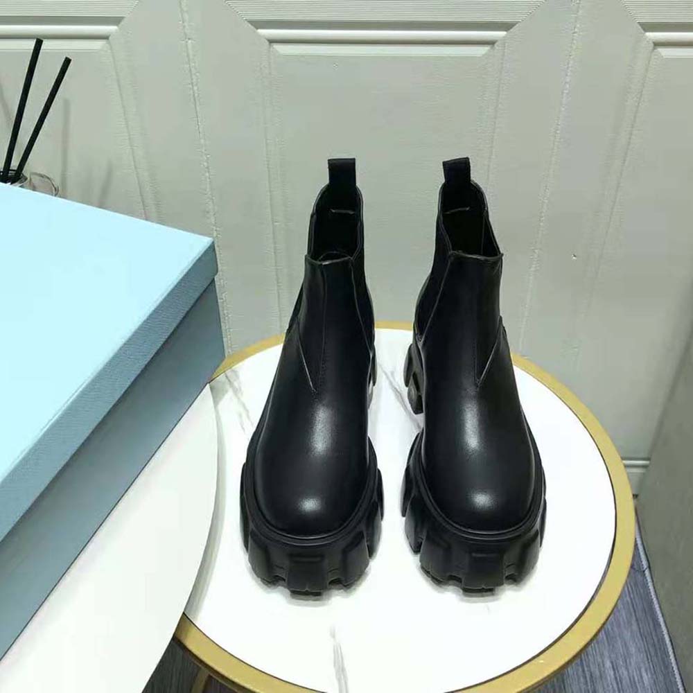 Close-up of black brushed leather texture on Prada Women Monolith Booties