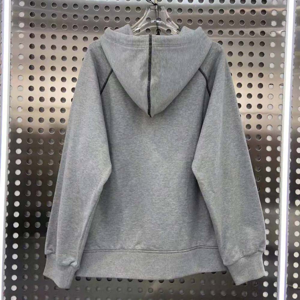 Side angle showing texture contrast on Prada Women Oversized Hoodie with Re-Nylon Inserts