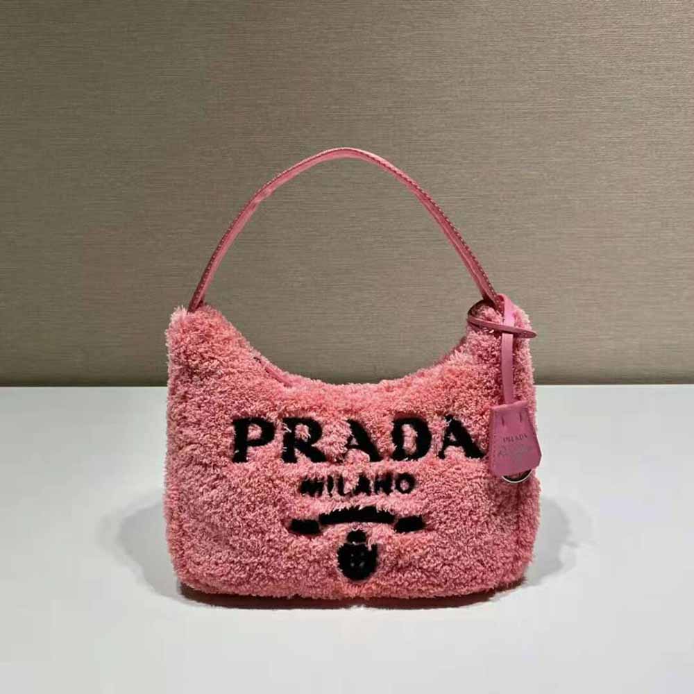 Close-up of pink terry fabric and silver logo detail on Prada mini-bag