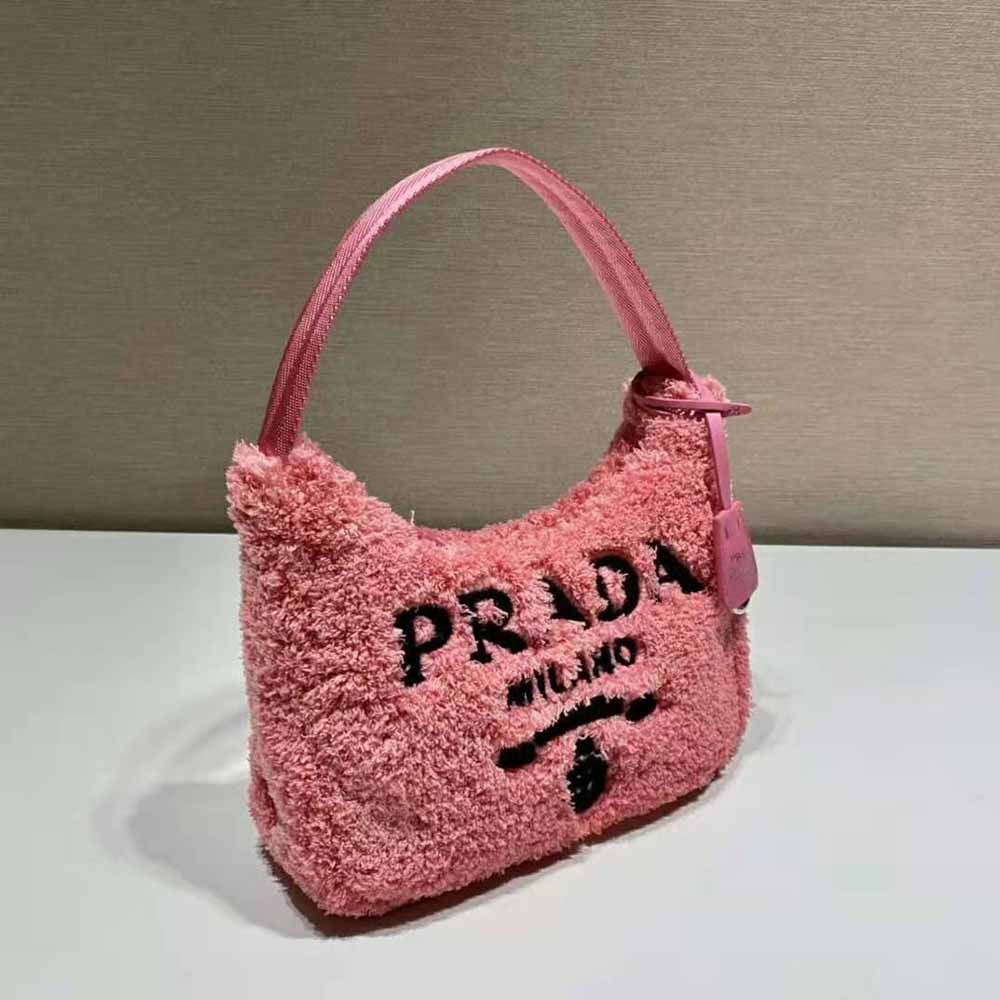 Side angle showing silhouette and adjustable strap of Prada Women Re-Edition 2000 Mini-Bag