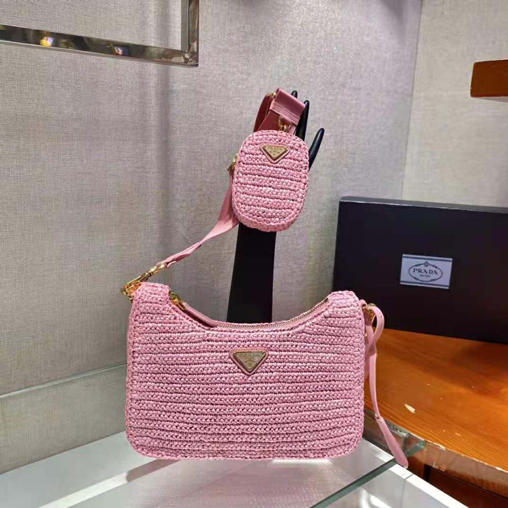 Close-up of gold-tone logo and closure on Prada Women Re-Edition 2005 Raffia Bag-Pink