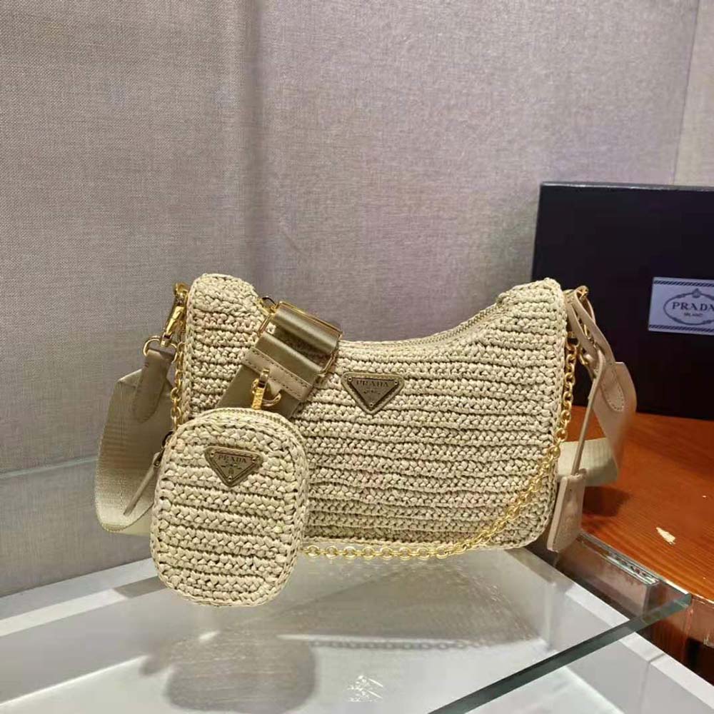 Side angle of Prada Women Re-Edition 2005 Raffia Bag-Natural with adjustable strap