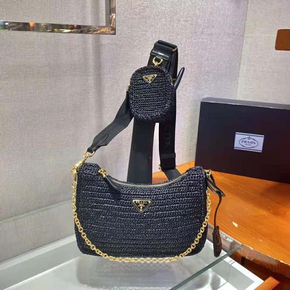 Close-up of woven raffia texture and gold hardware on Prada bag