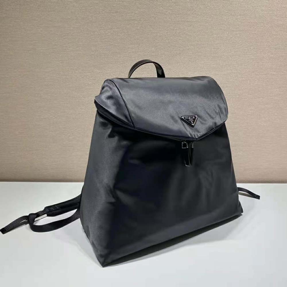 Side angle showing adjustable straps on Prada Women Re-Nylon and Leather Backpack