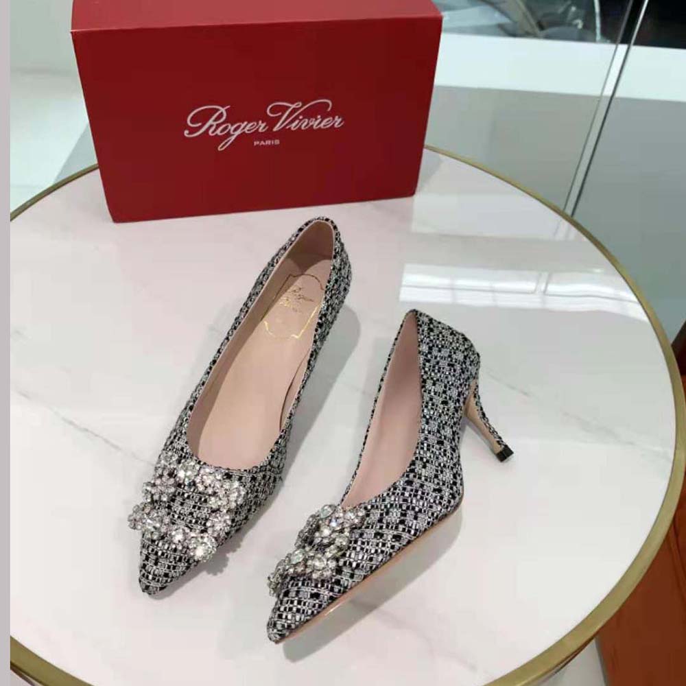 Close-up on sparkling flower strass buckle of Roger Vivier pumps