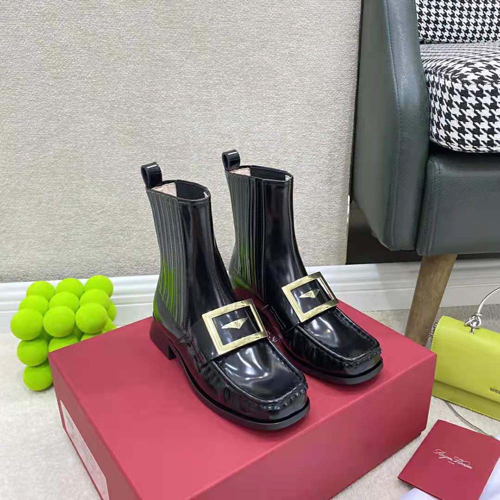 Close-up of Viv’ metal buckle detail on Roger Vivier Chelsea booties