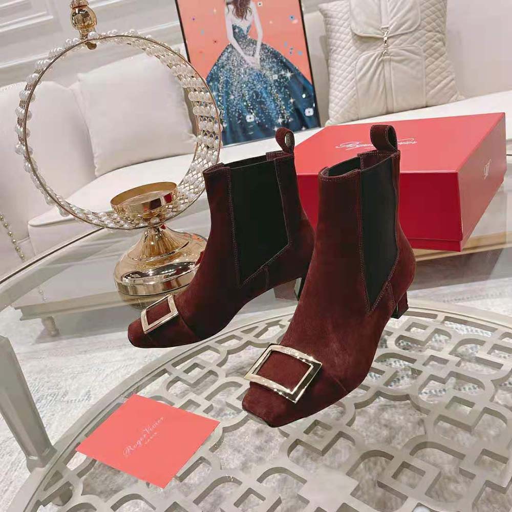 Close-up of metal buckle detail on Roger Vivier Trompette Chelsea Booties