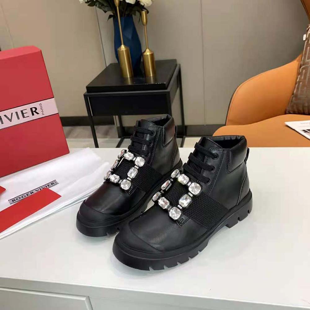 Overhead view showing lace-up design and leather texture of Roger Vivier booties