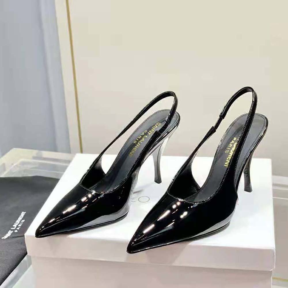 Close-up of gold YSL logo detail on Viper Slingback Pumps