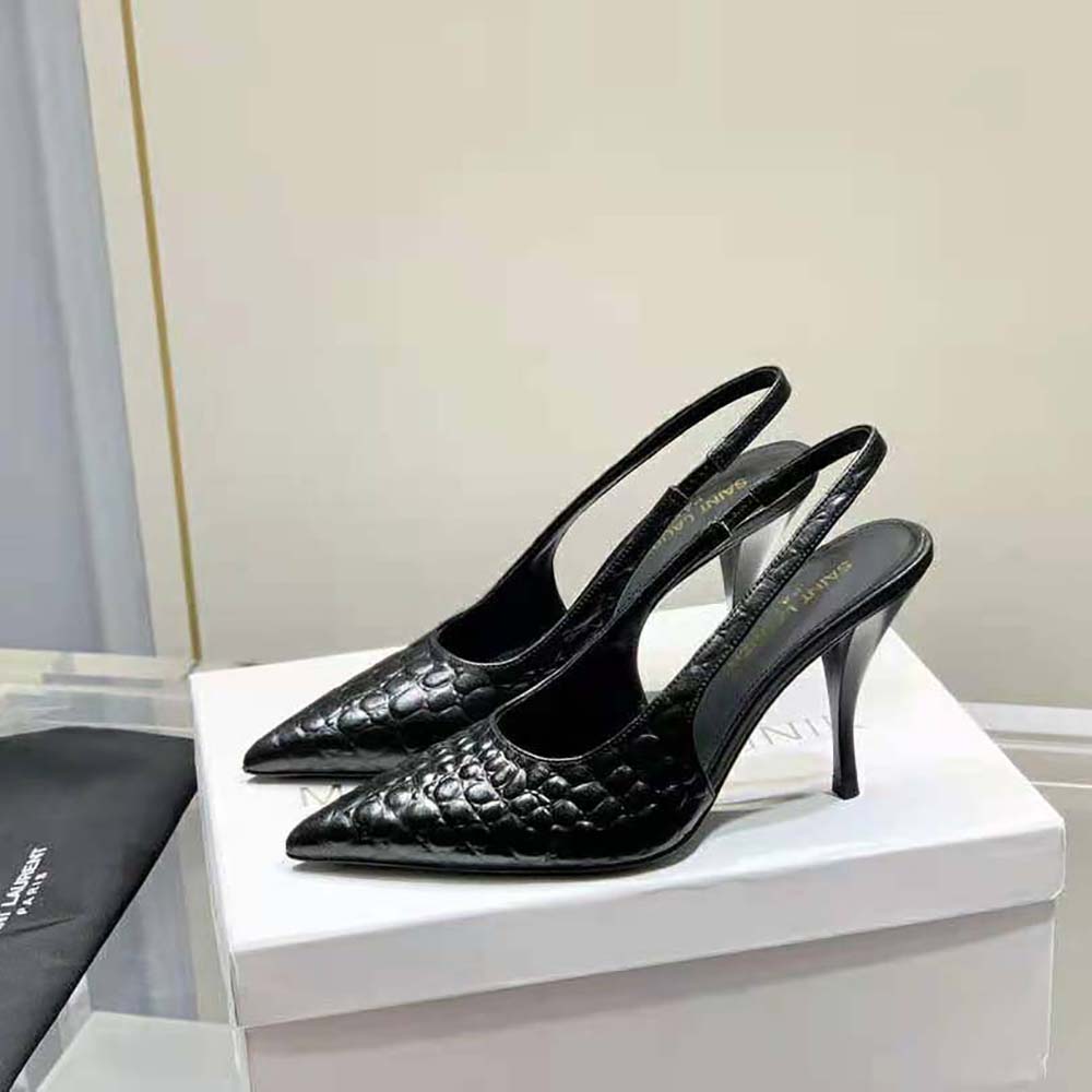 Close-up of gold YSL hardware on Viper Slingback Pumps leather texture