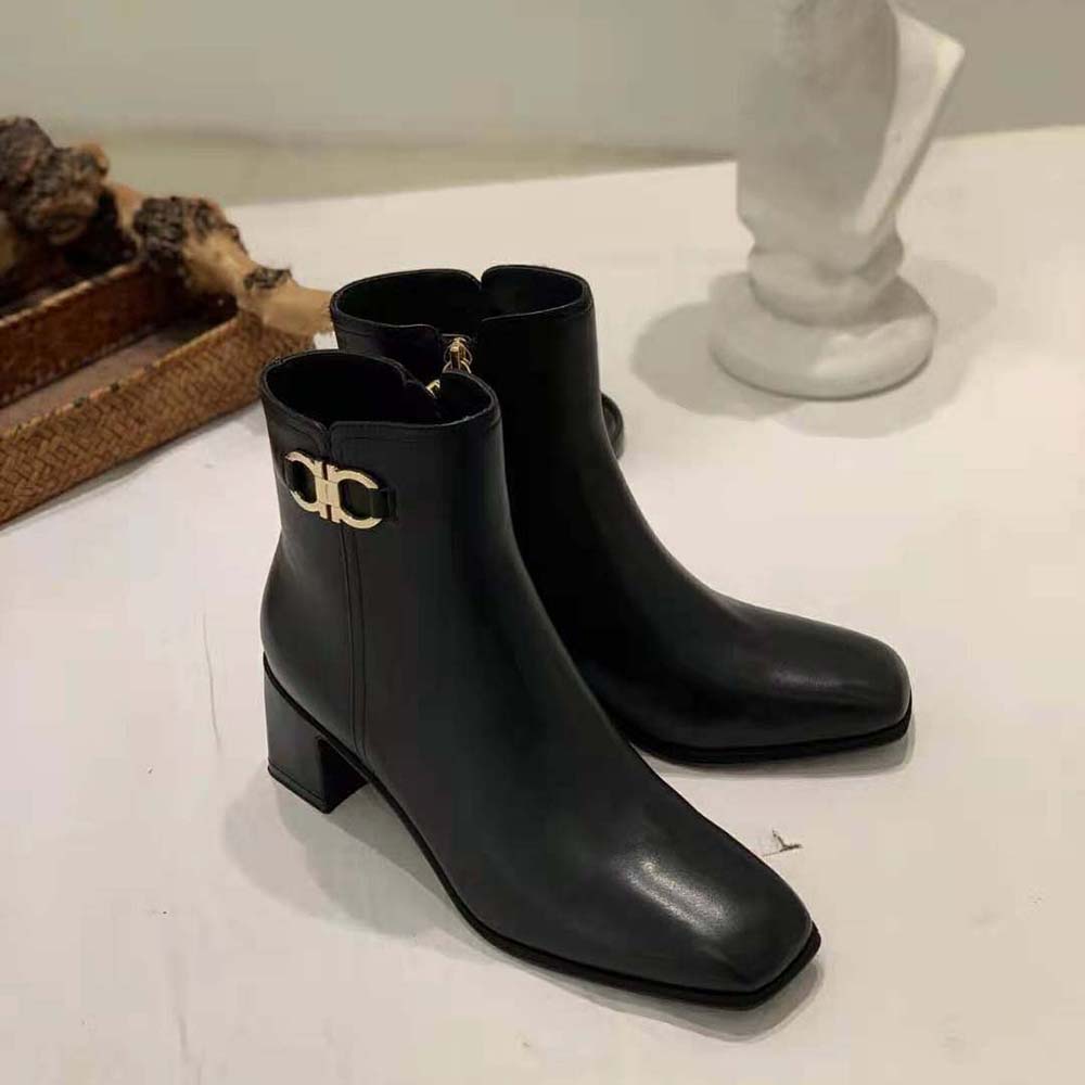 Back view showing stacked 55mm heel on Ferragamo Gancini bootie