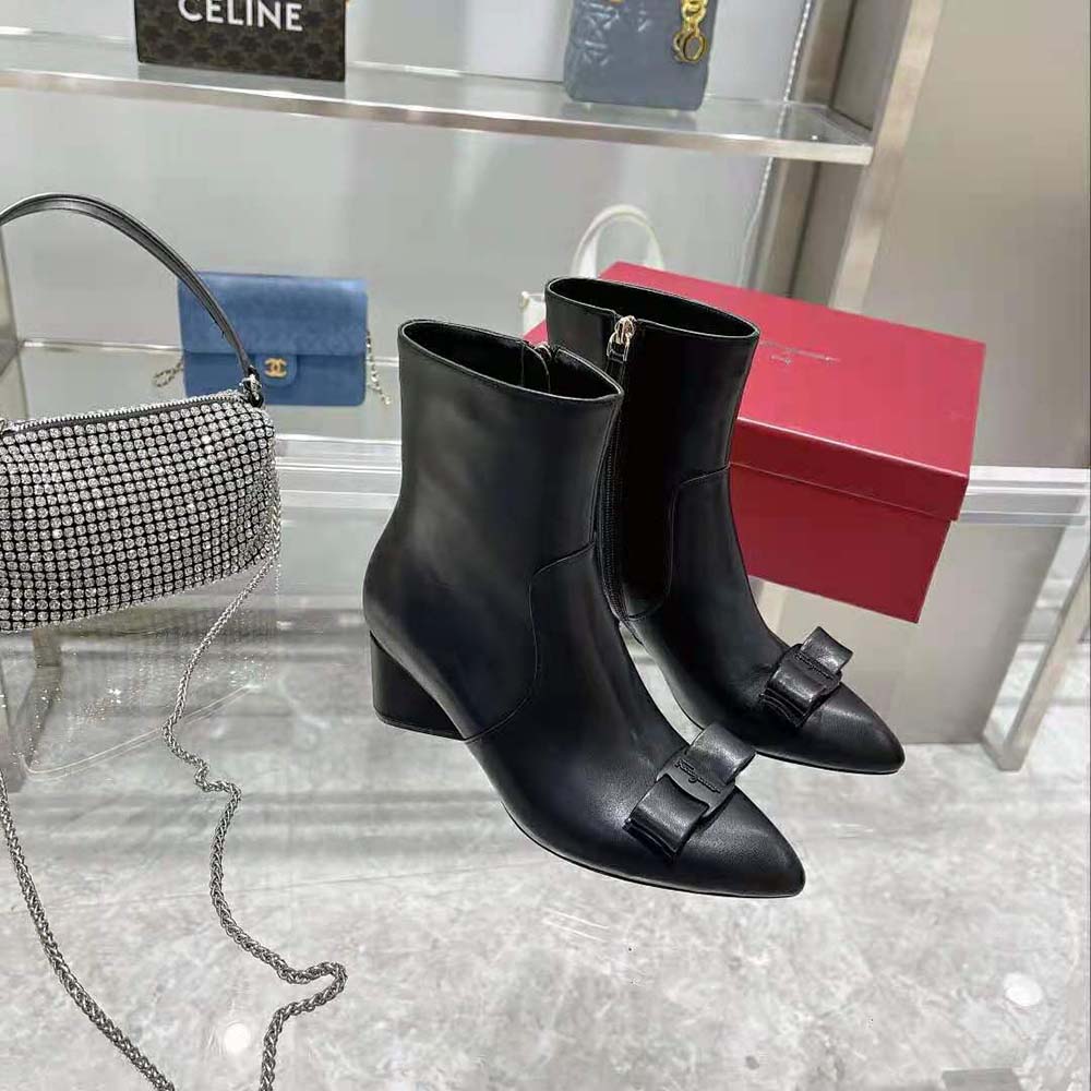 Rear angle showing black leather-covered 55mm heel of Salvatore Ferragamo bootie