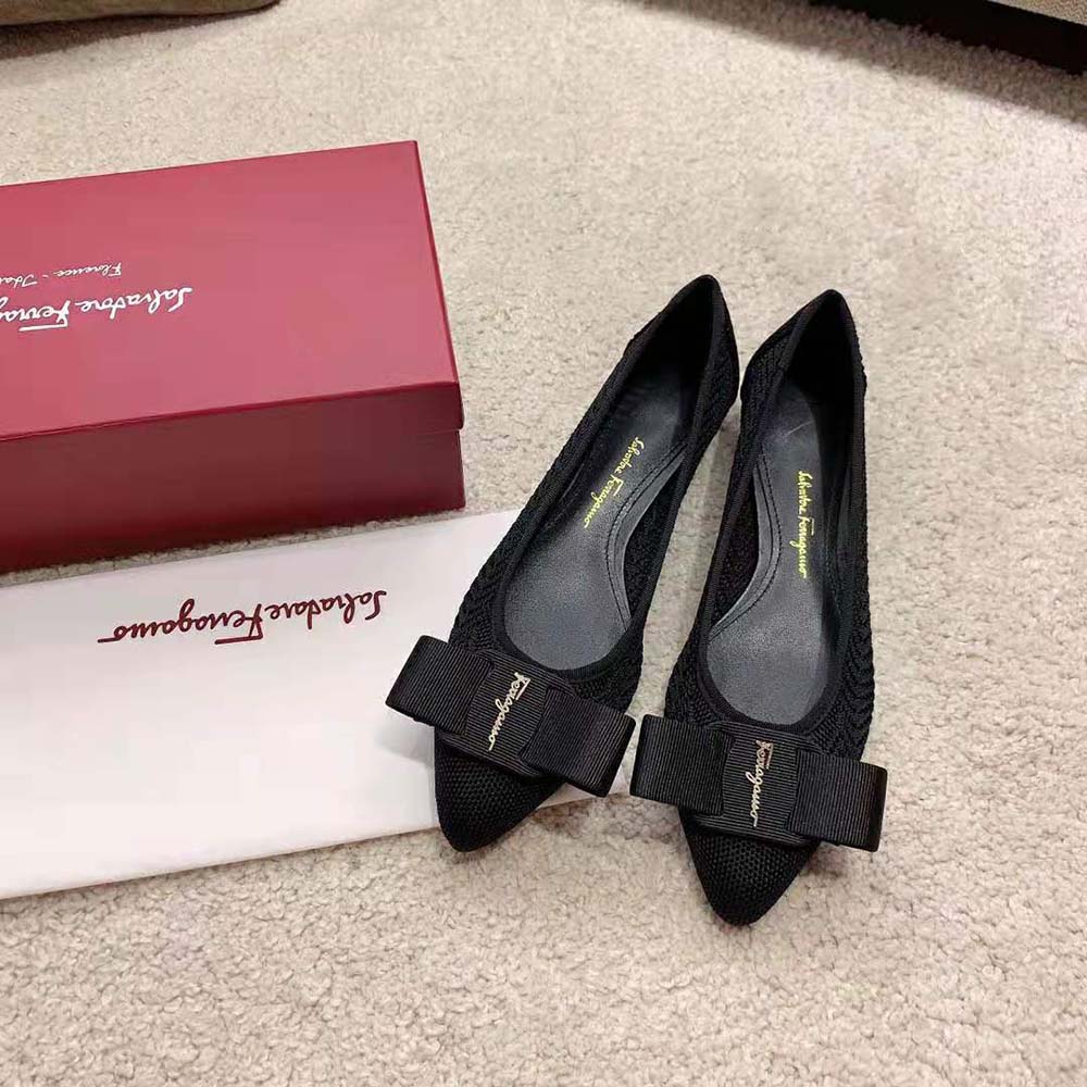 Close-up of polished Gancini hardware on Salvatore Ferragamo ballet flat