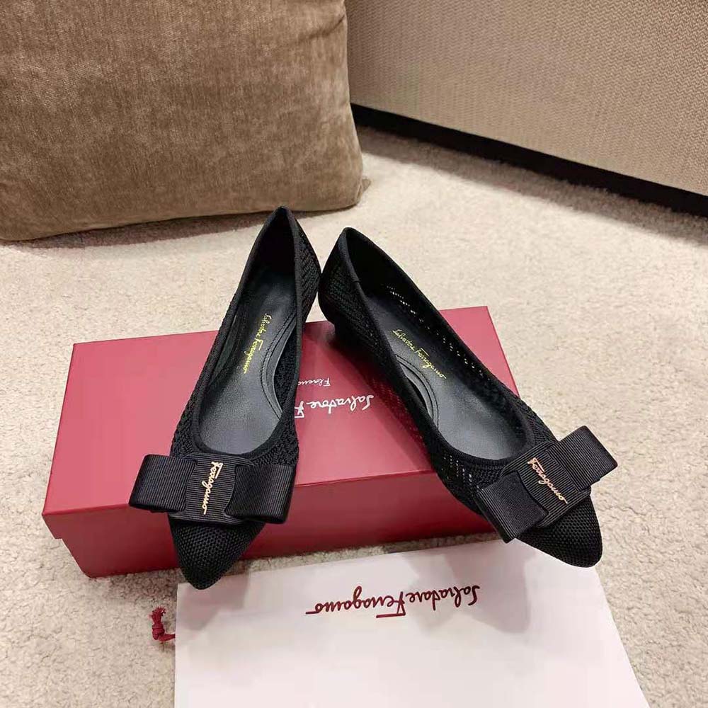 Top angle showing smooth black leather and silhouette of the ballet flat