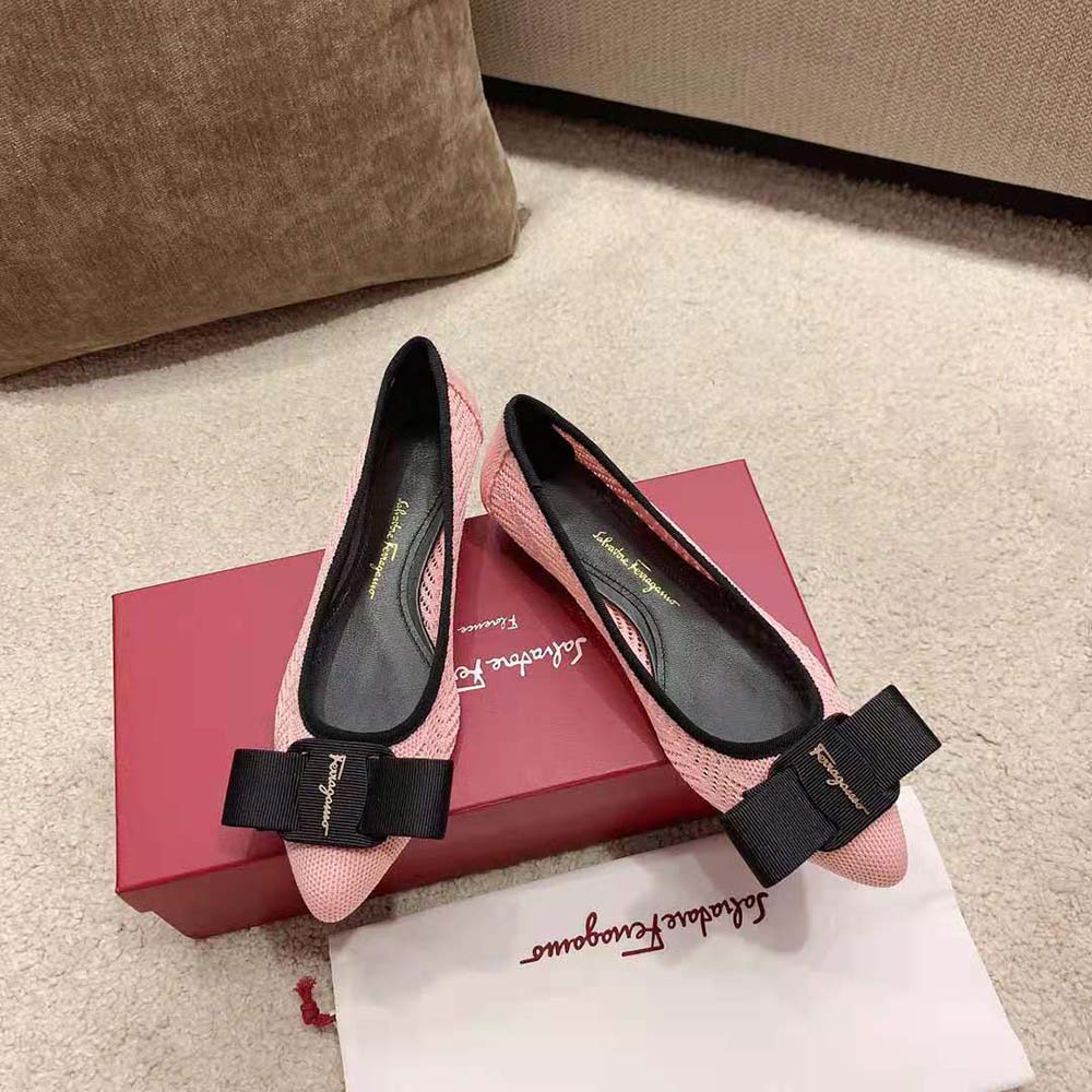 Top view showcasing smooth pink leather and slip-on design flats