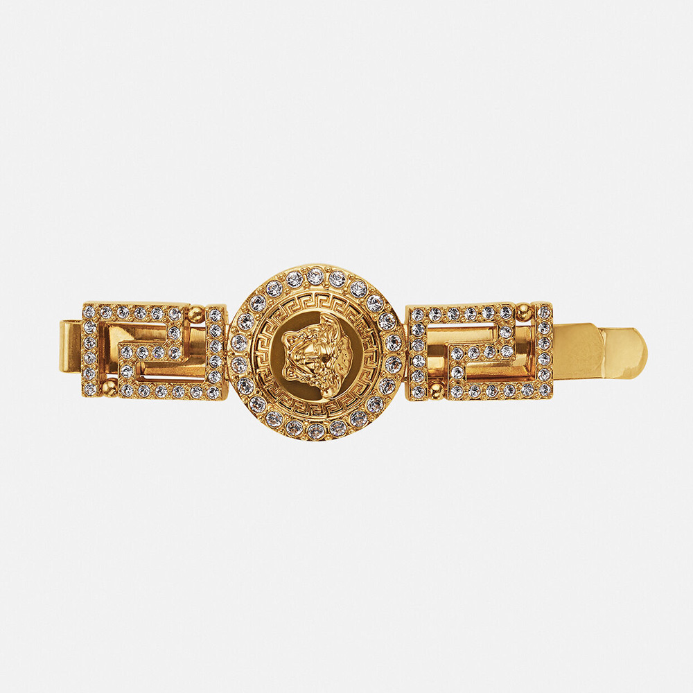 Close-up of Versace Women Greca Hair Pin showcasing gold Greca motif