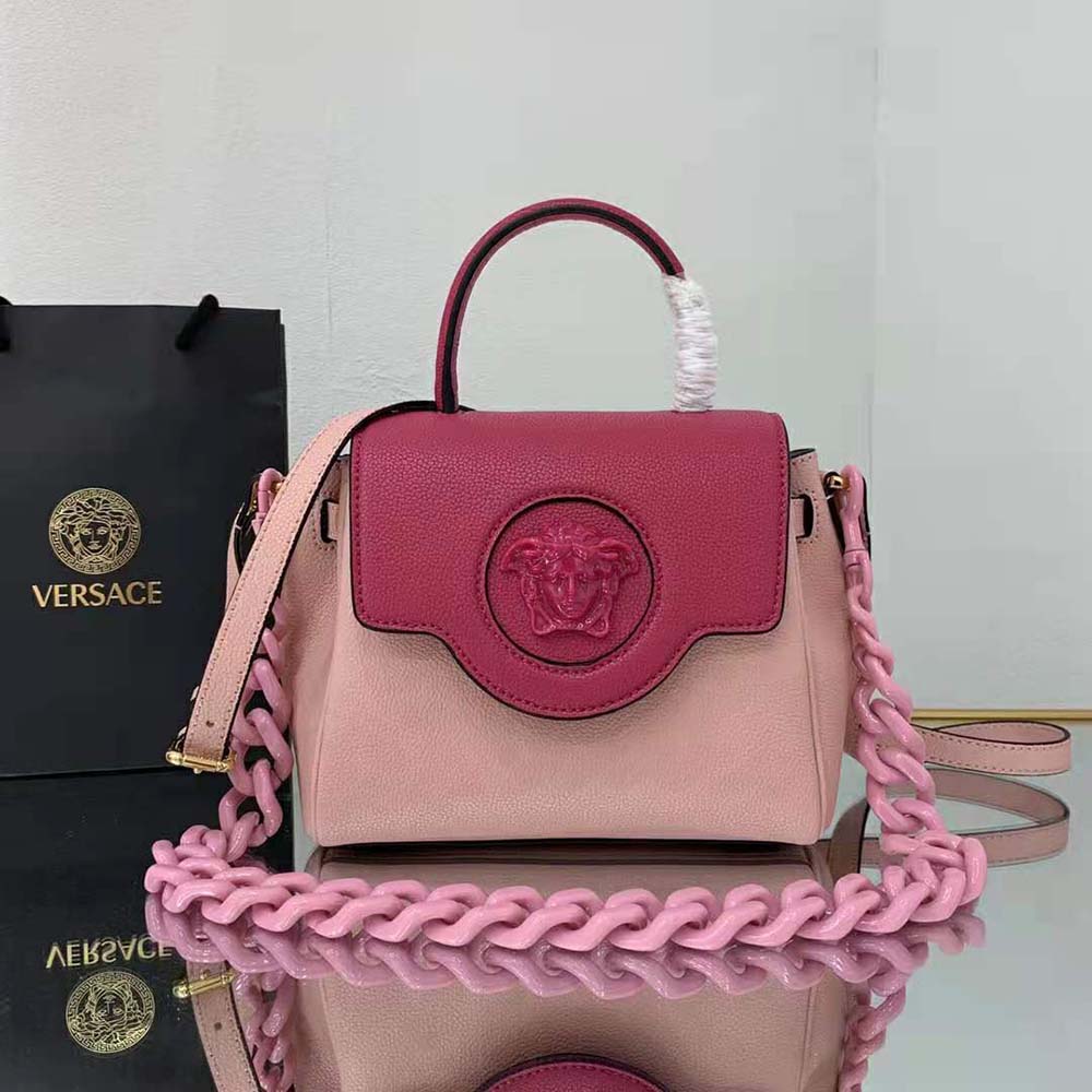 Close-up of gold Medusa emblem on Versace Women LA Medusa Small Handbag