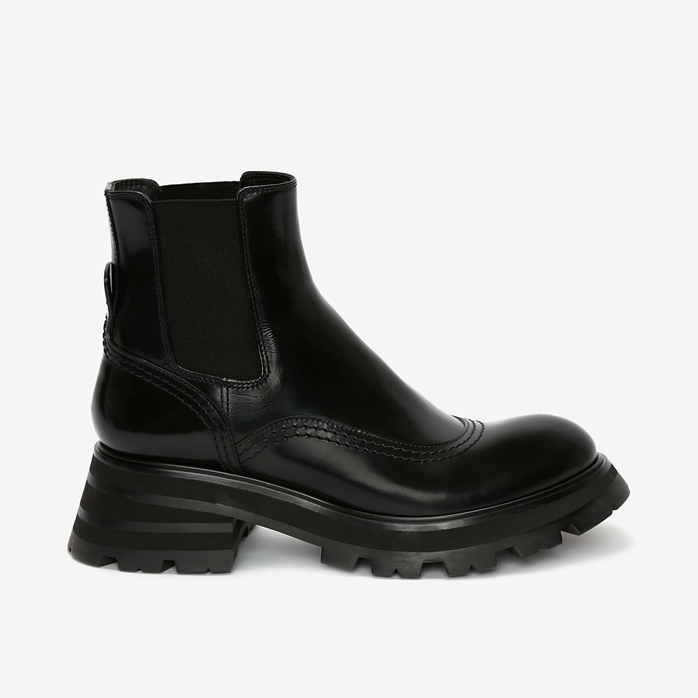 Side view of Alexander Mcqueen Women Wander Chelsea Boot-Black showing elastic panels