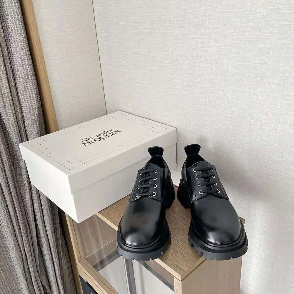 Close-up of black leather and signature sole on Alexander Mcqueen sneakers
