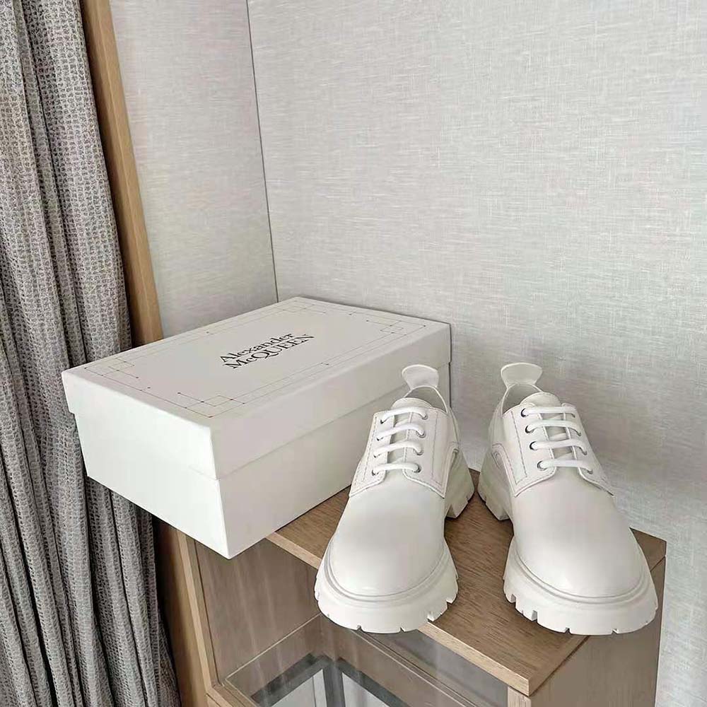 Side profile showing chunky silhouette of Alexander Mcqueen Women Wander Lace-Up-White