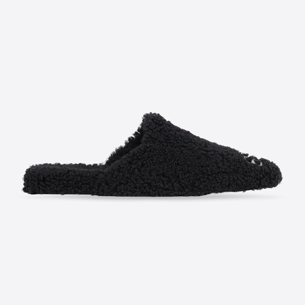 Side profile of Balenciaga Women Cosy BB Mule in black faux shearling
