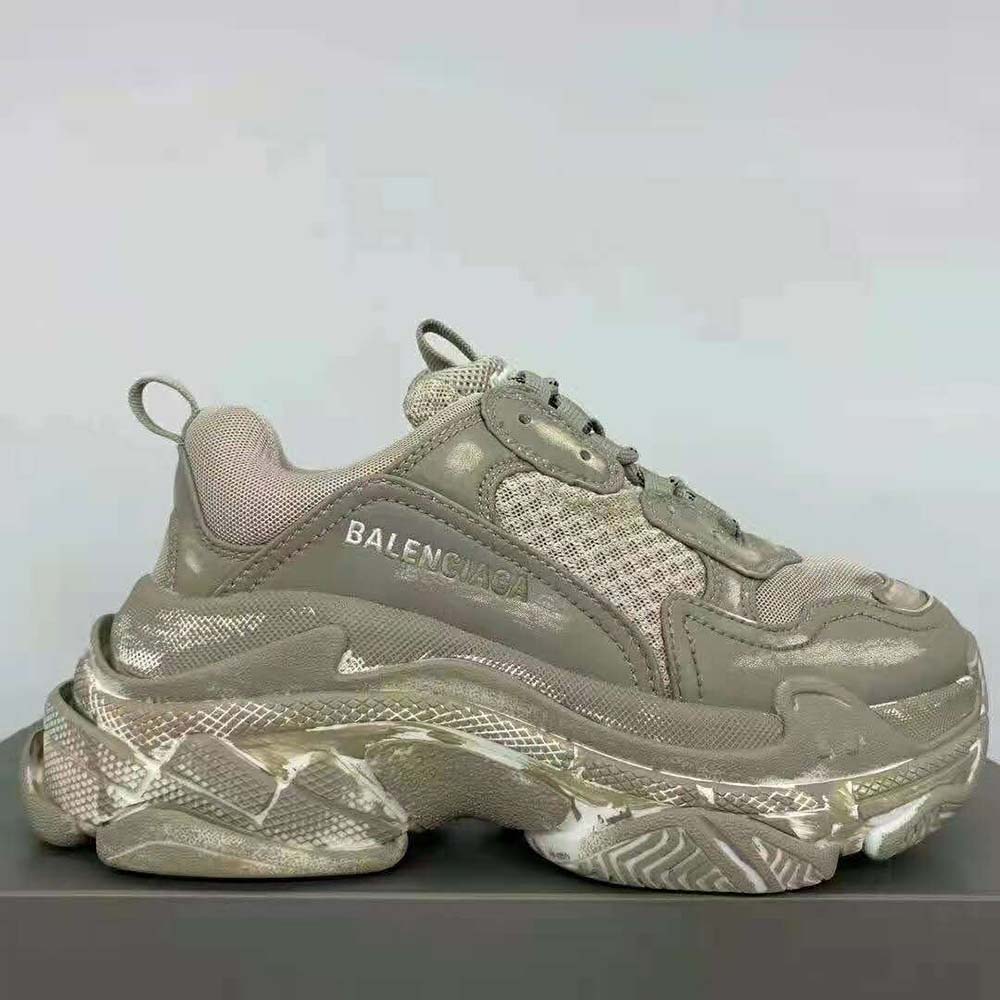Close-up of distressed leather and mesh on Balenciaga Women Triple S Faded Sneaker