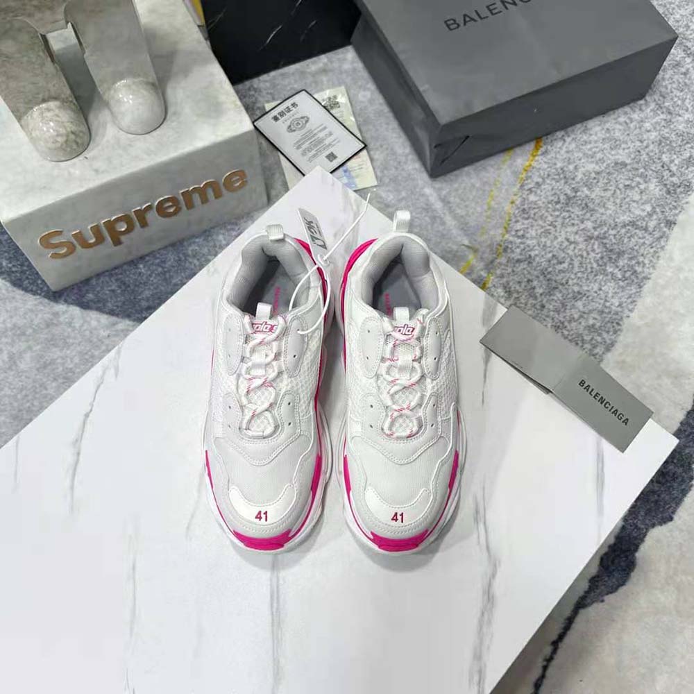 Close-up detail of Balenciaga Women Triple S Sneaker in Fluo Pink logo and mesh