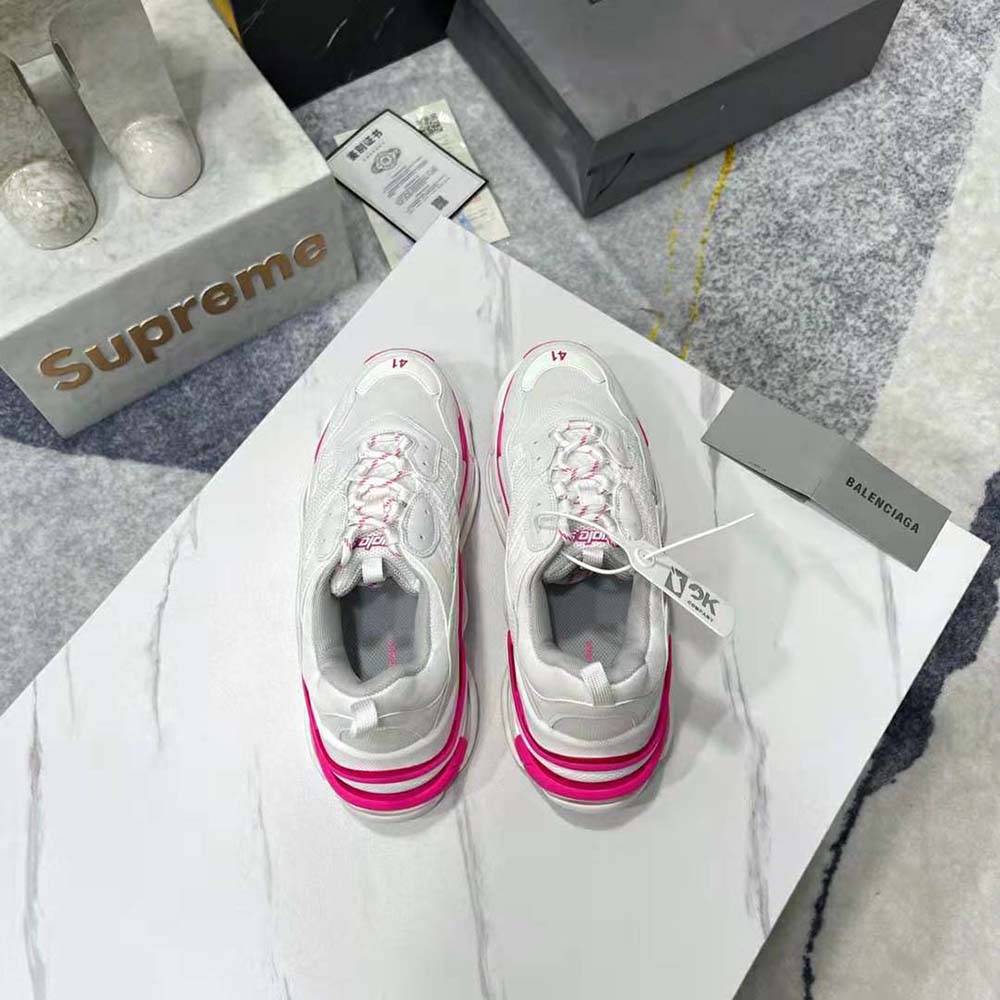 Top angle shot highlighting laces and color contrast of Balenciaga Women Triple S Sneaker